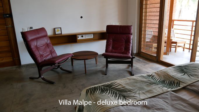 Recliner chairs and table in bedroom